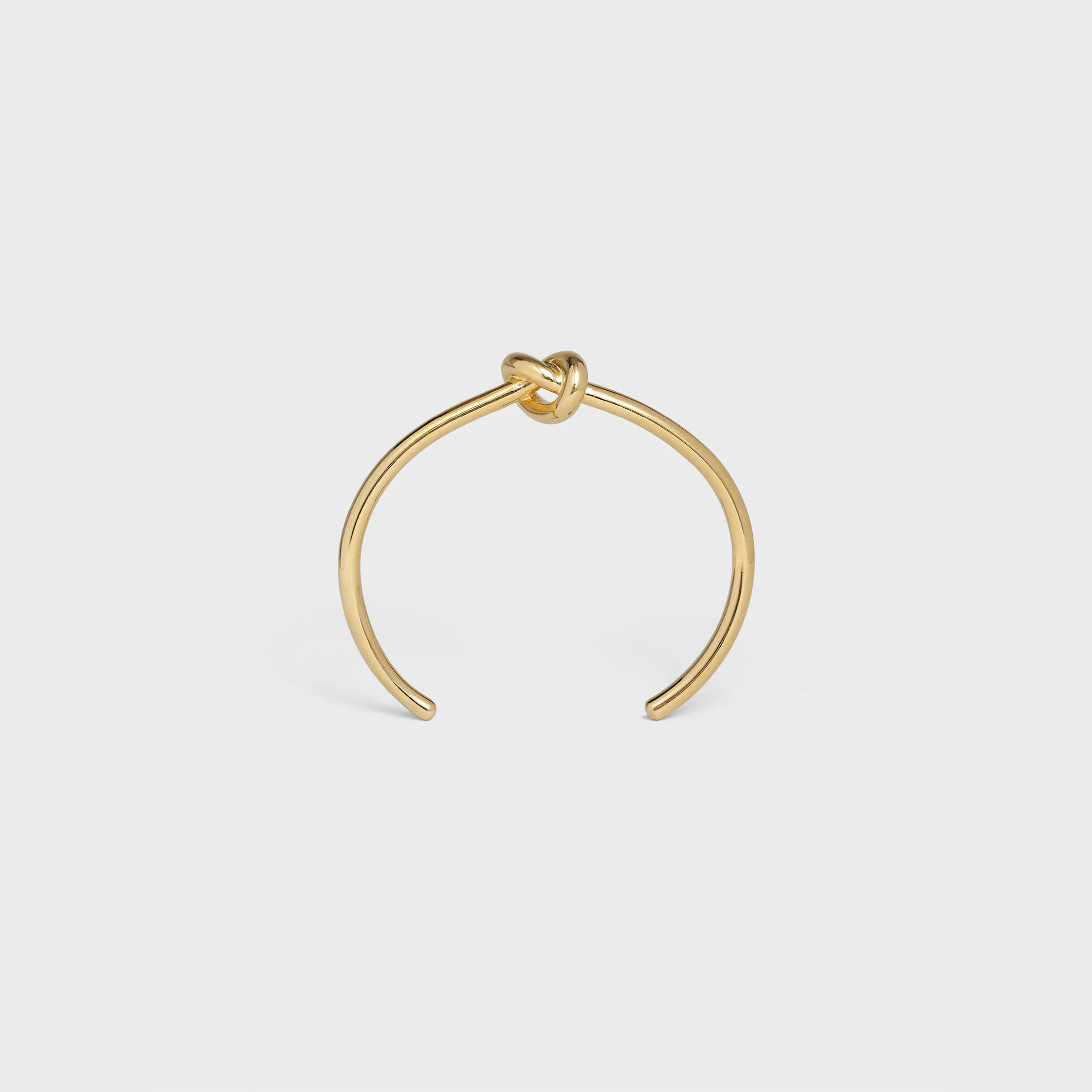 Knot extra-tunn armband i blank metall med guldslag