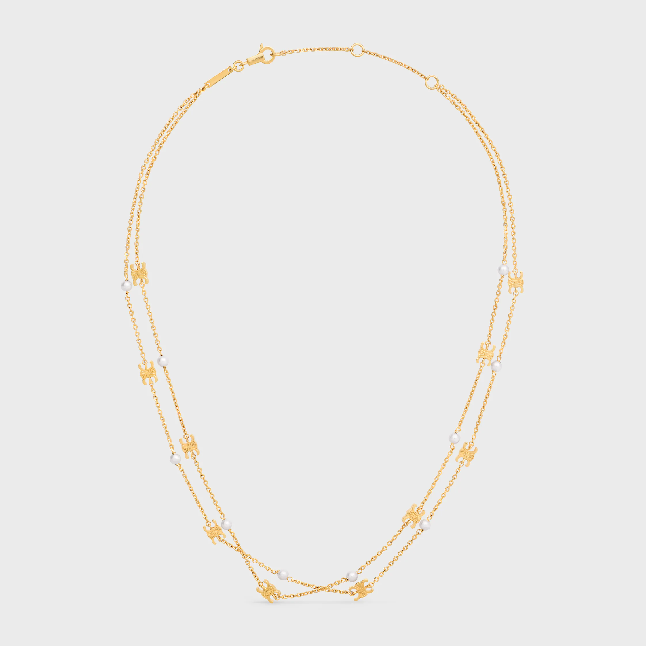 Triomphe Pearl dubbel halsband i blankt brons med gyllene beläggning och resinperlor
