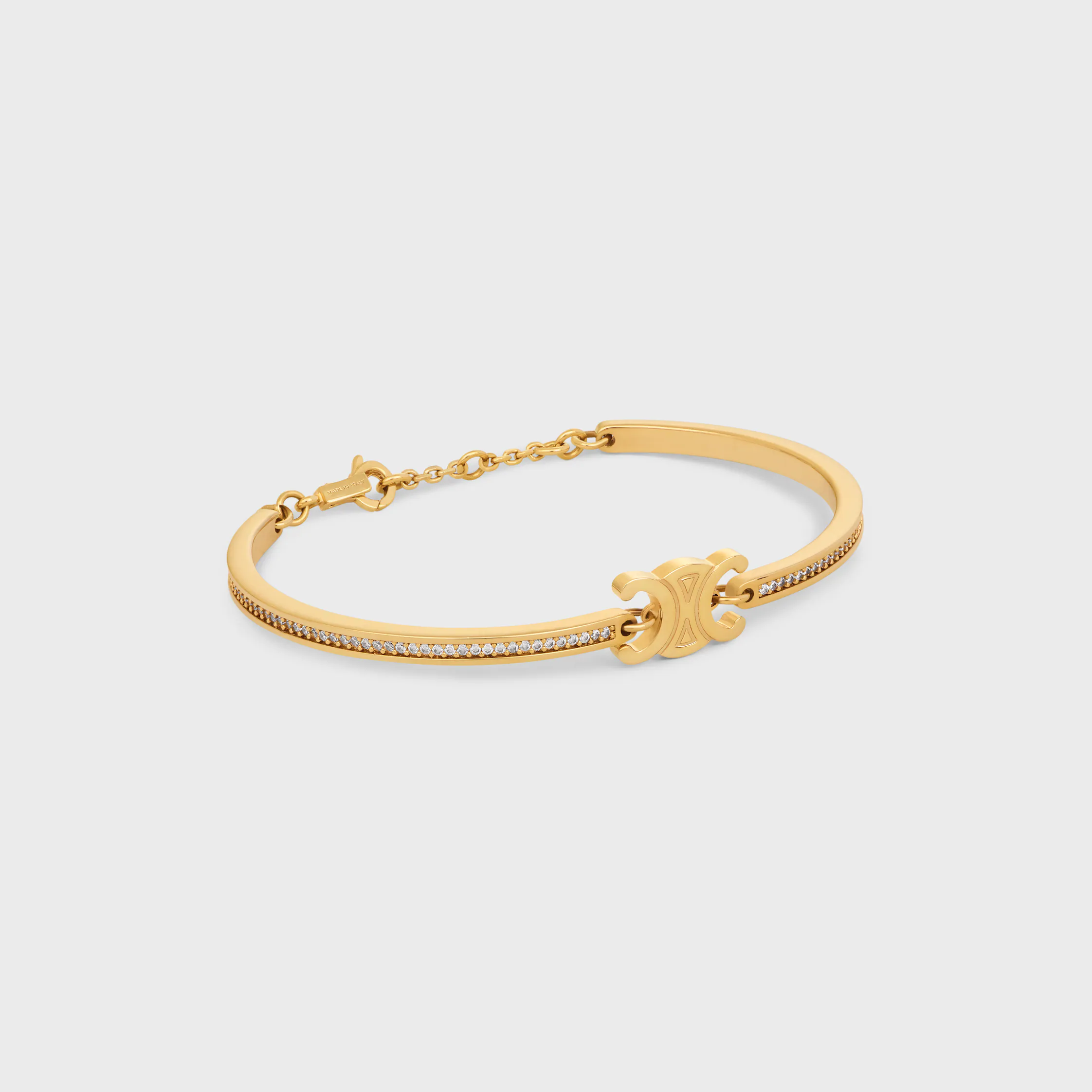 Triomphe-brytbar glittrande armband i strass och blankbrons med gyllene finish