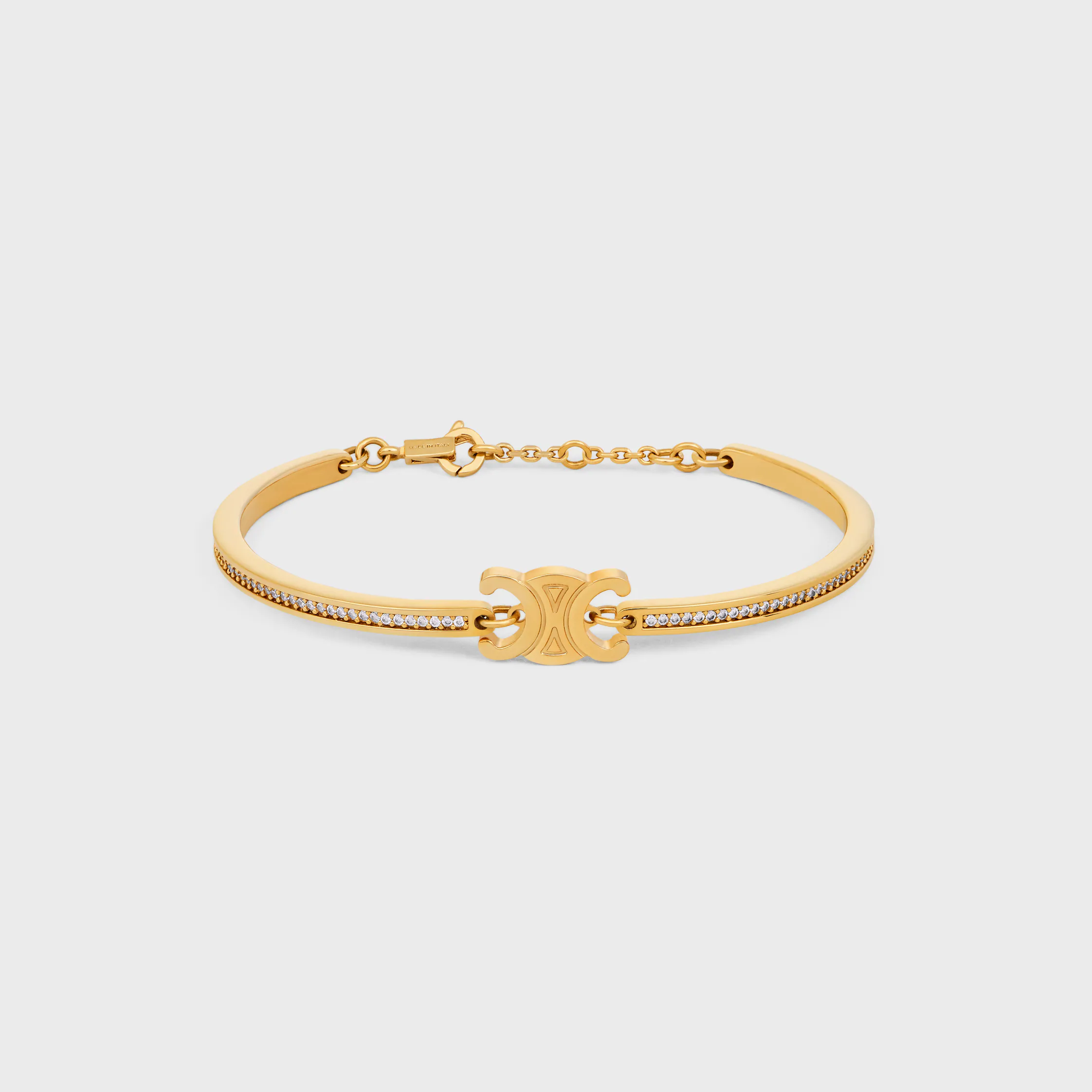 Triomphe-brytbar glittrande armband i strass och blankbrons med gyllene finish