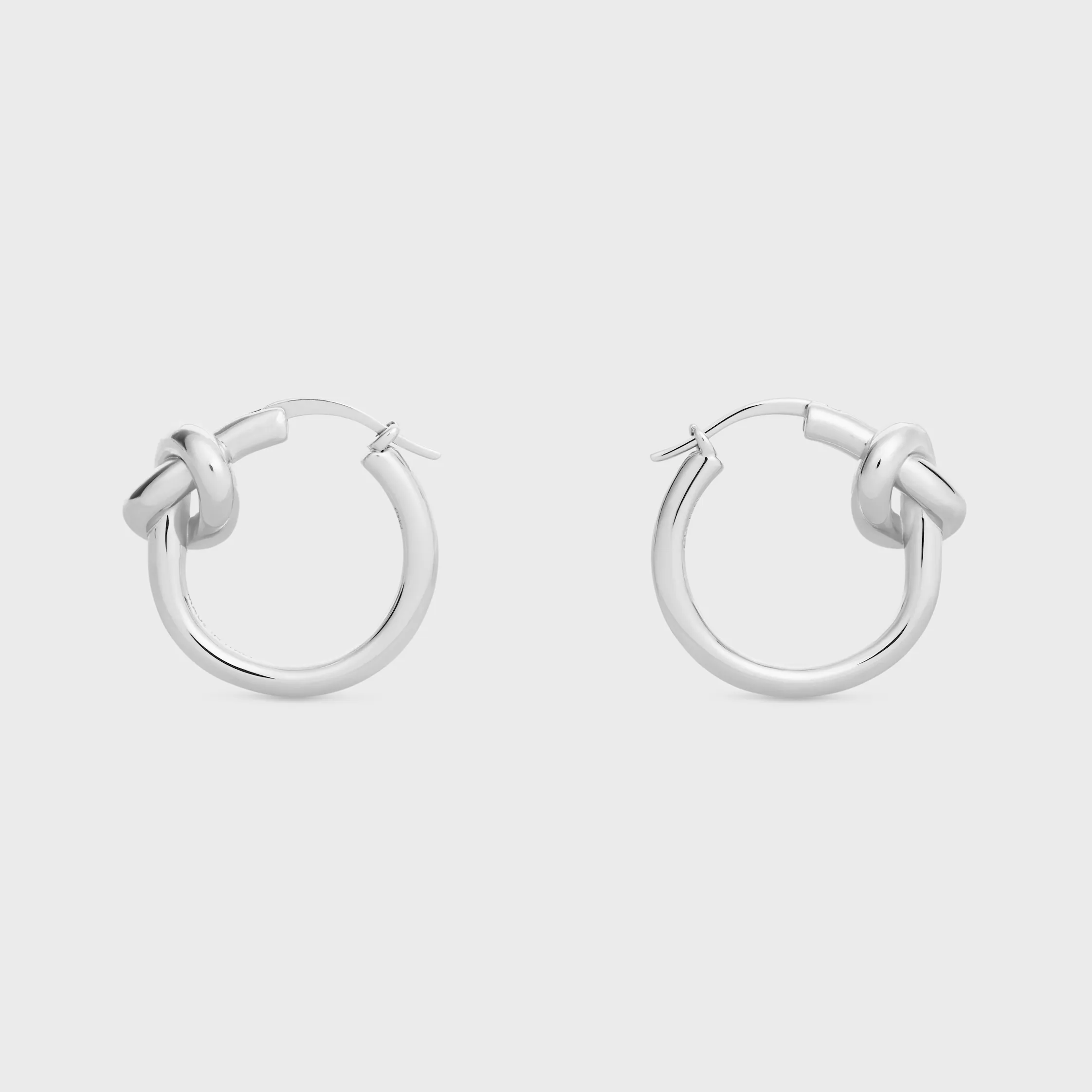 Knot Small Hoops i blankt guld med rhodierad släpp
