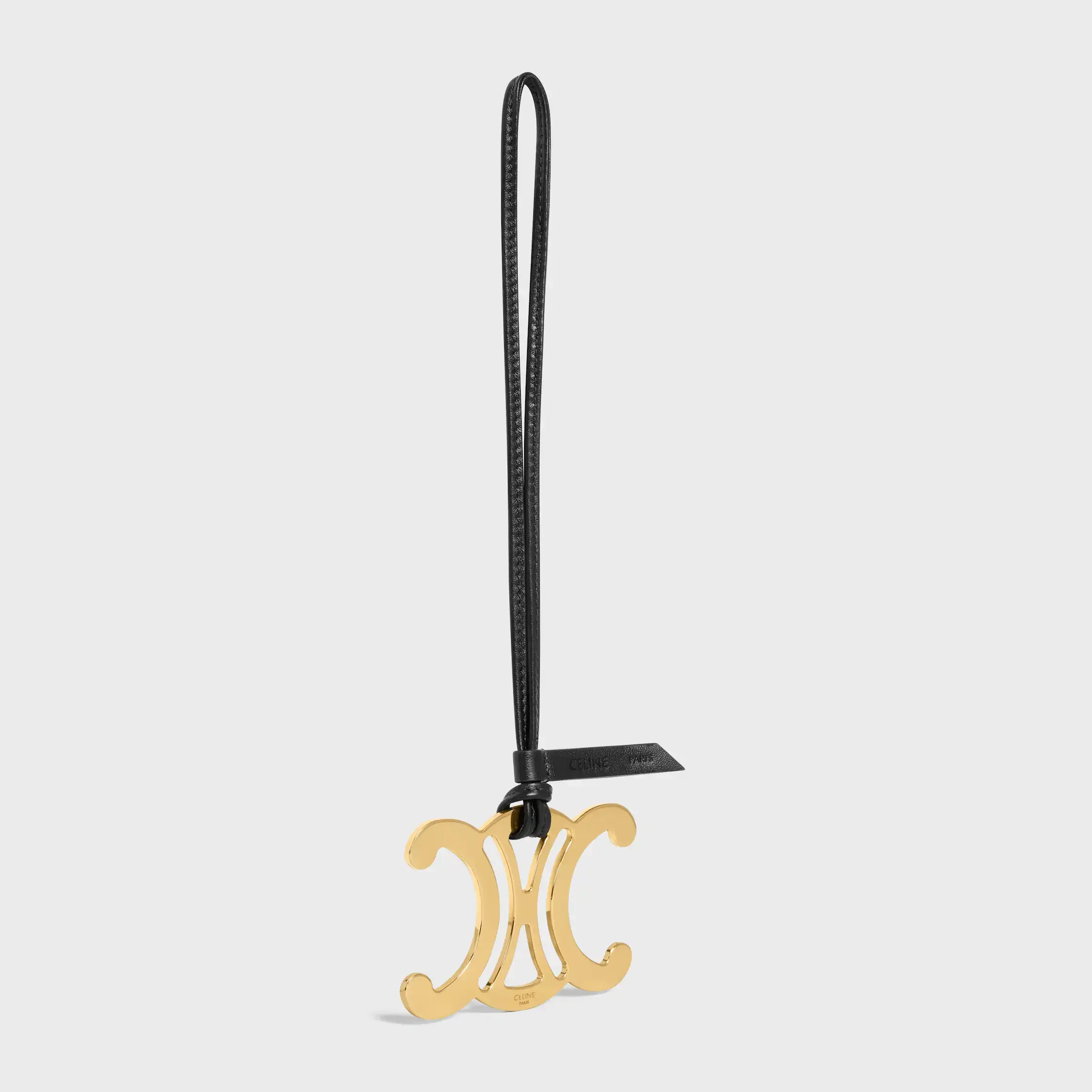 MAXI TRIOMPHE CHARM I METALL OCH SLIDIG LAMSKIN