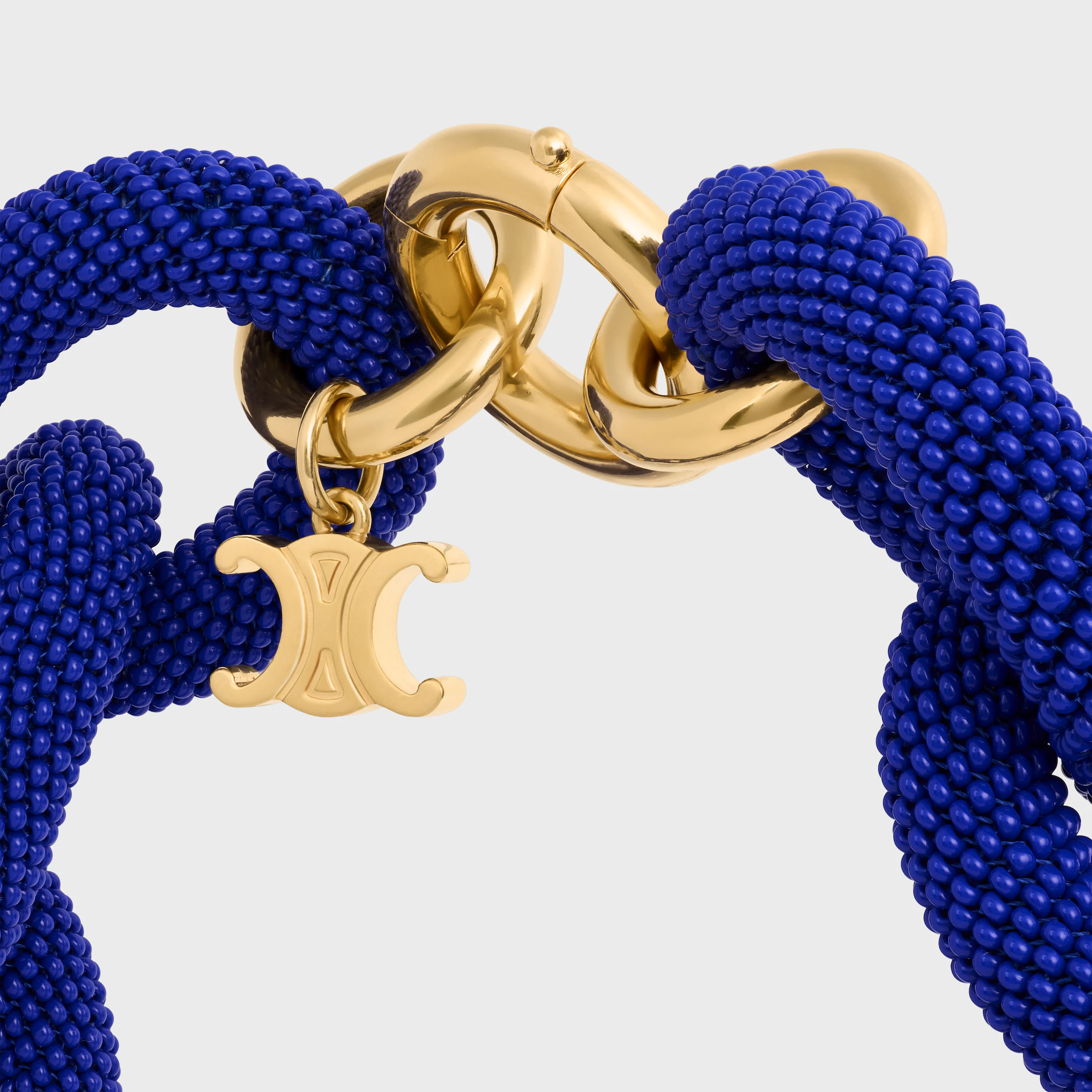 été Celine Links-halsband i klotar och blankt brons med gyllene beläggning