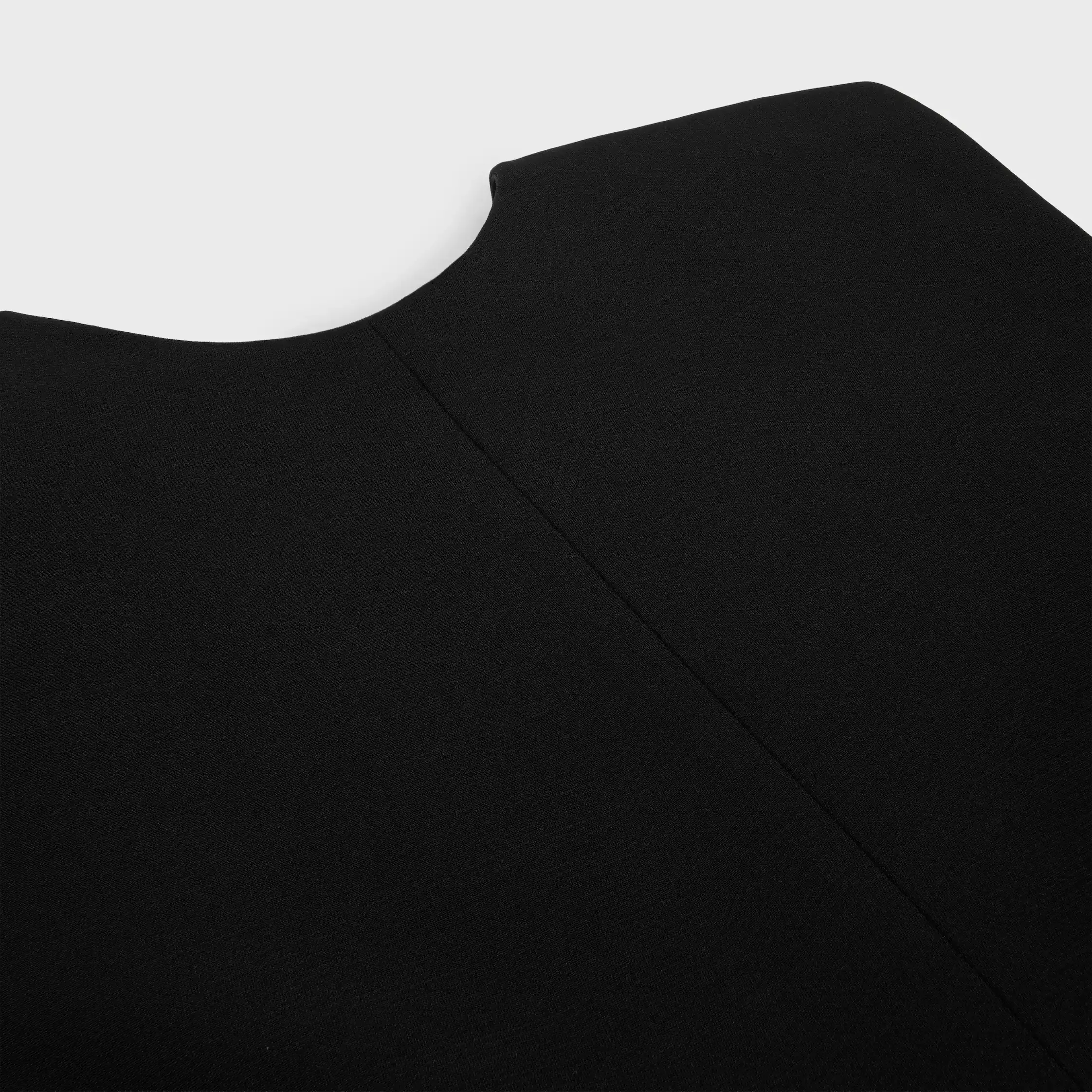 topp med peplum i ull och siden