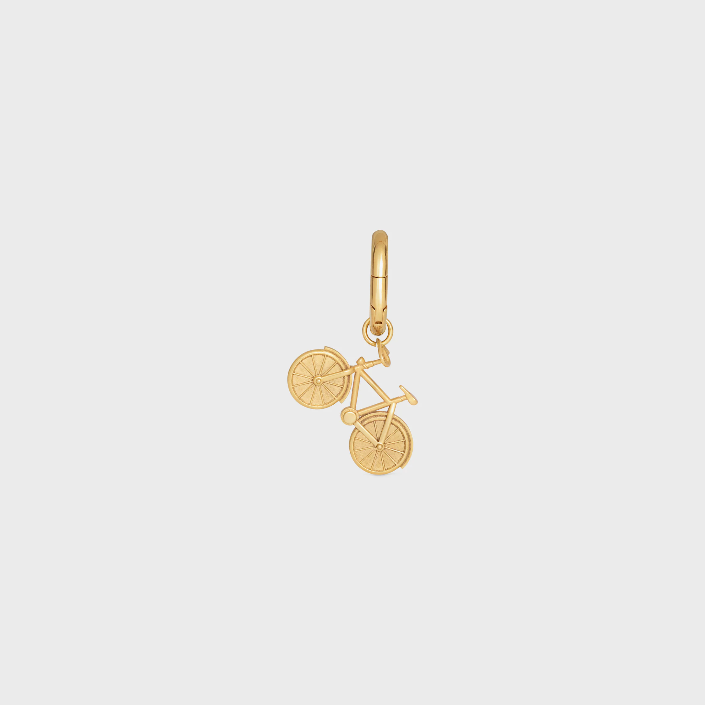 CHARMS CYKEL I BRONS MED GULDSLAG